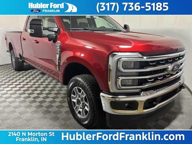 2026 Ford Super Duty F-250 Lariat in Ruby Red Metallic Tinted Clearcoat — front three-quarter view