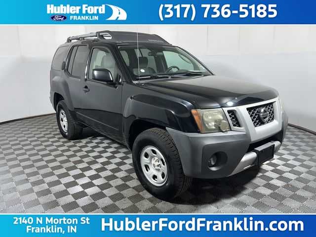 2011 Nissan Xterra X in Super Black — front three-quarter view