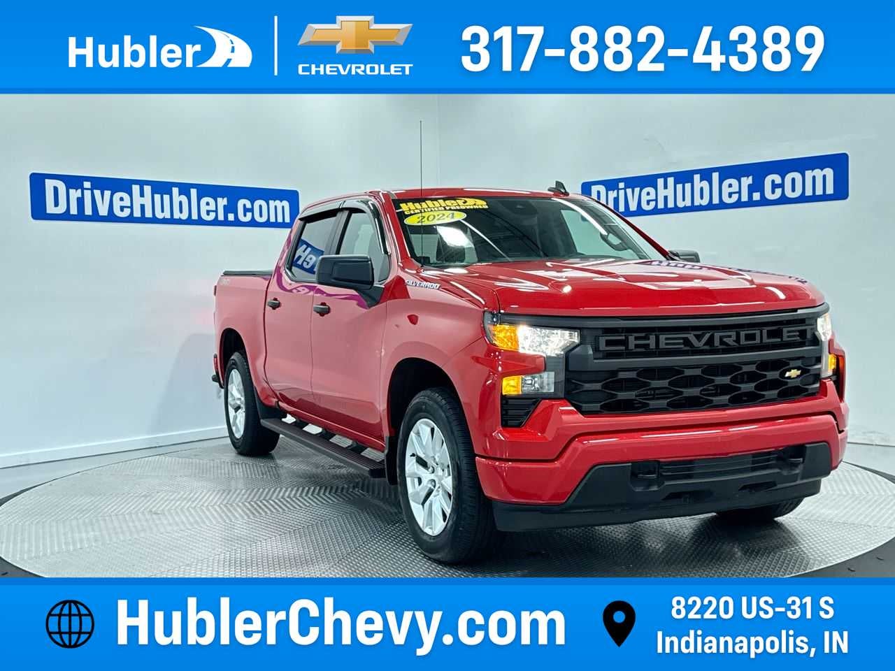 2024 Chevrolet Silverado 1500 Custom in Red Hot — front three-quarter view