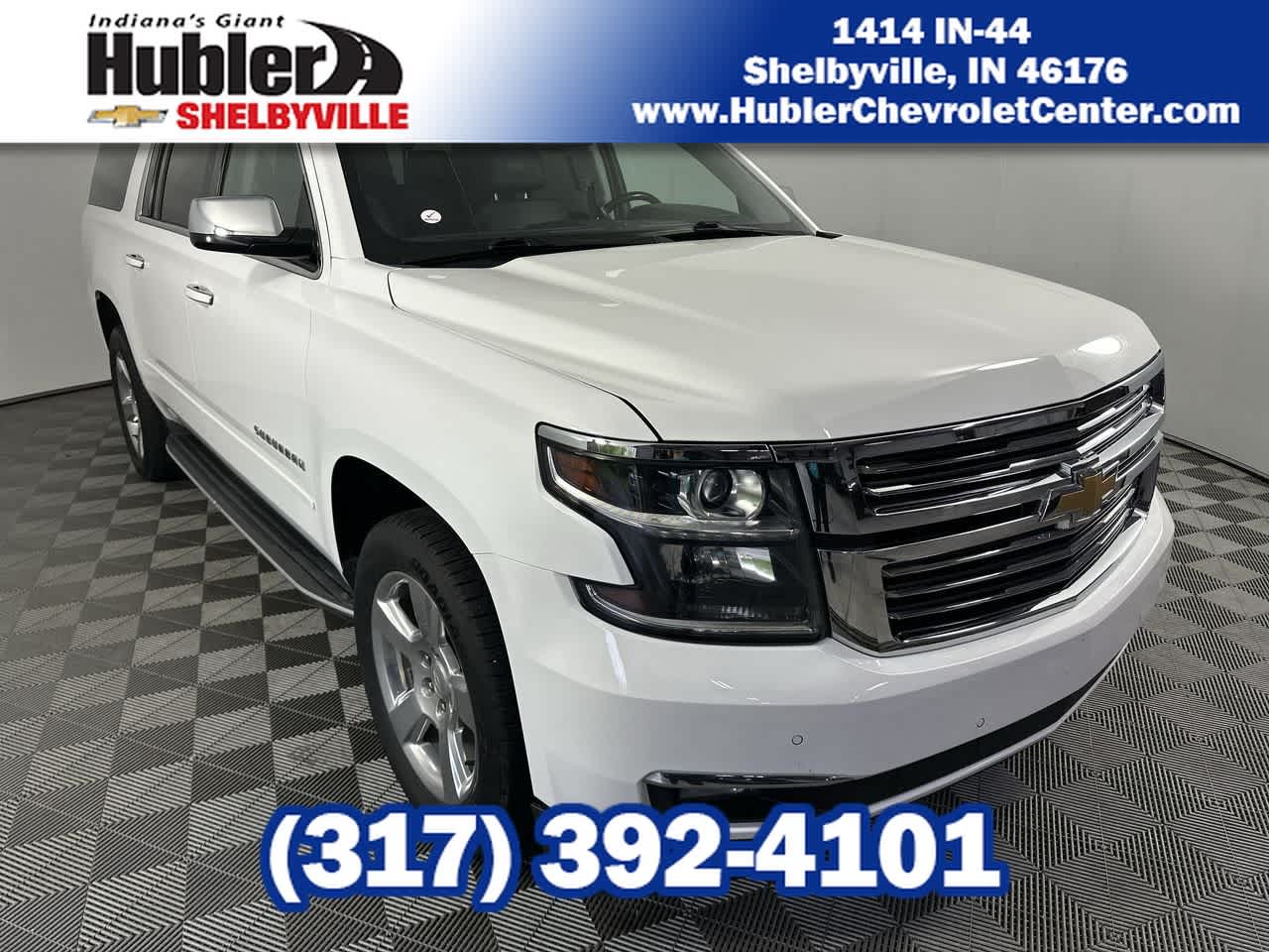 2018 Chevrolet Suburban Premier in Summit White — front three-quarter view