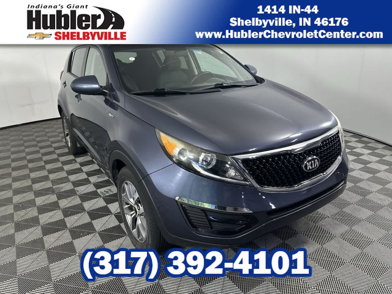 2016 Kia Sportage LX in Blue Ribbon Metallic — front three-quarter view