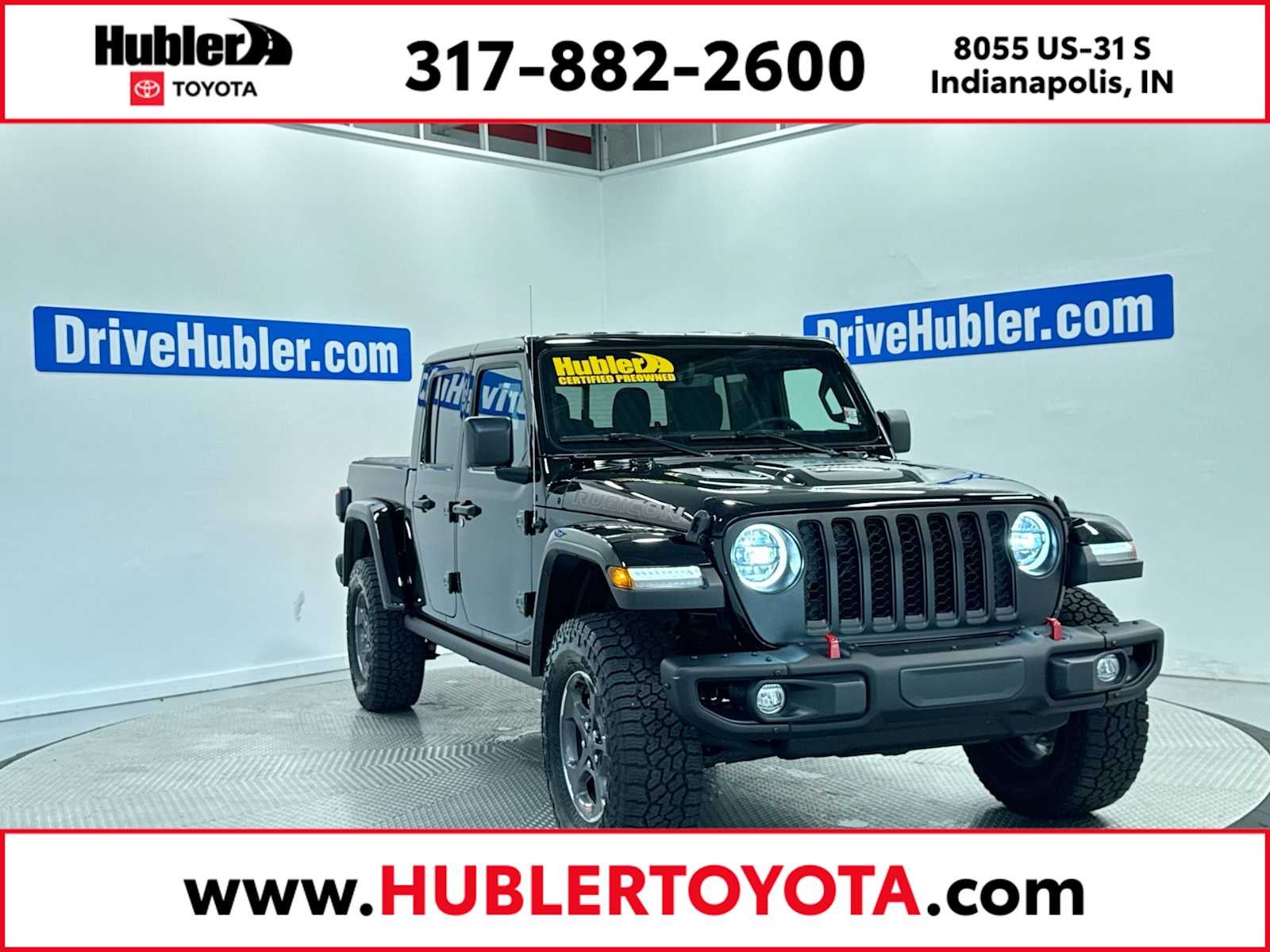 2023 Jeep Gladiator Rubicon in Black Clearcoat — front three-quarter view