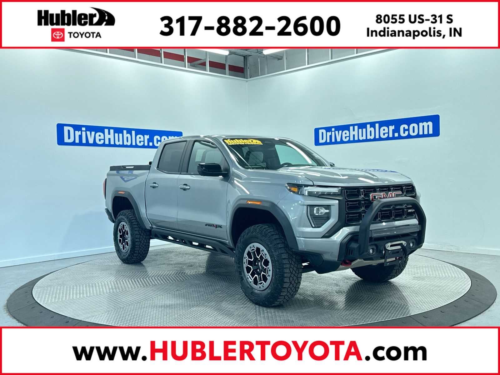 2023 GMC Canyon 4WD AT4X in Sterling Metallic — front three-quarter view