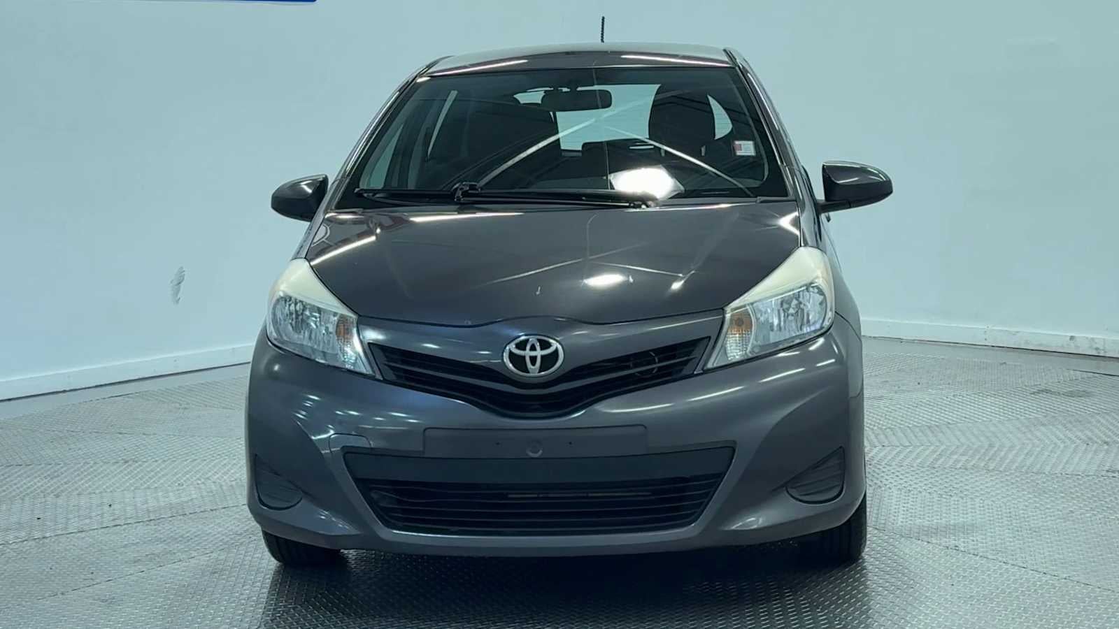 2014 Toyota Yaris — rear three-quarter view