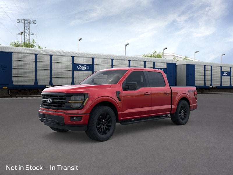 2026 Ford F-150 XLT in Ruby Red Metallic Tinted Clearcoat — front three-quarter view