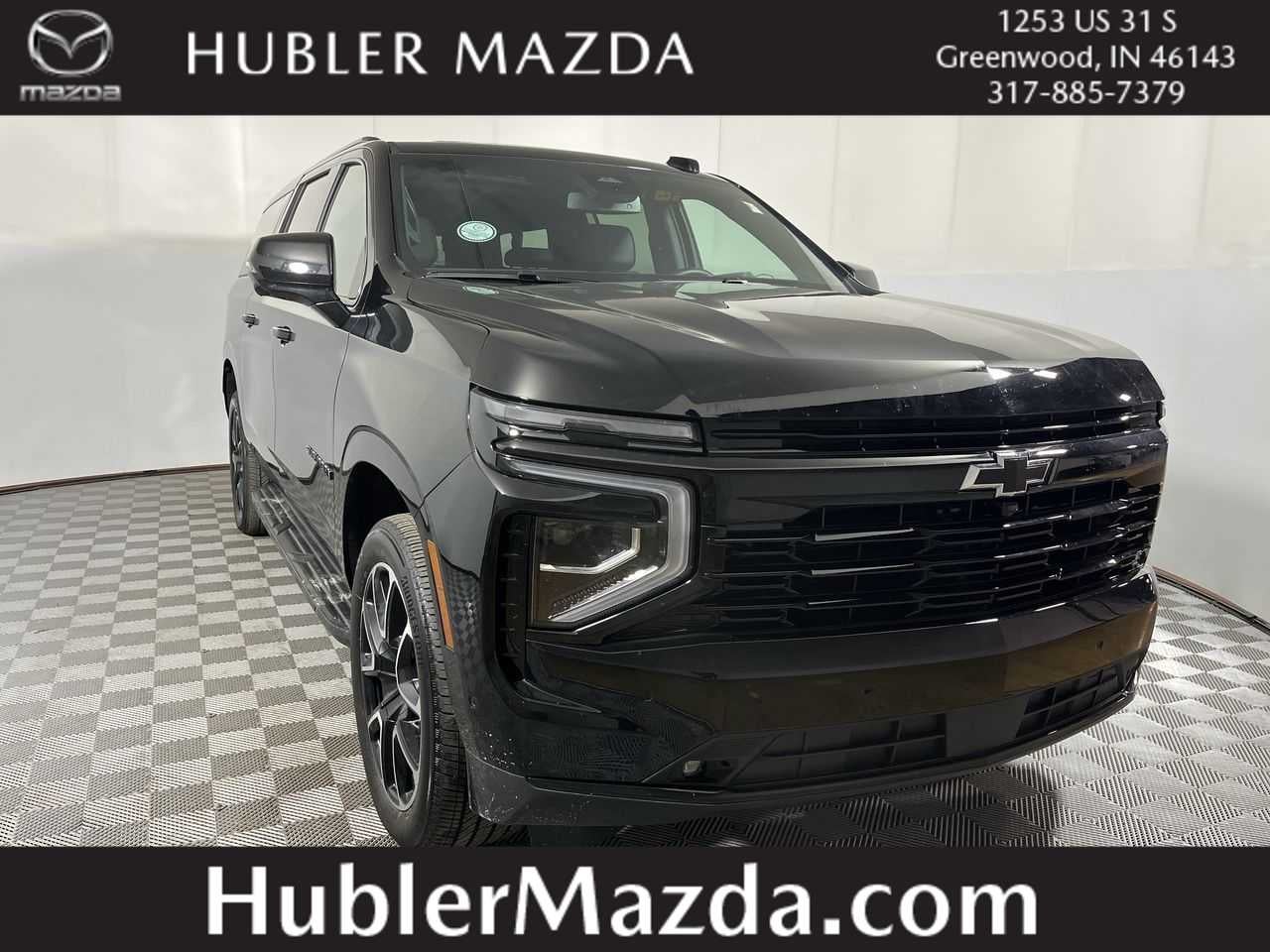 2026 Chevrolet Suburban RST in Black — front three-quarter view