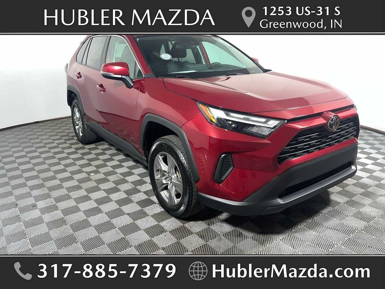 2025 Toyota RAV4 XLE in Ruby Flare Pearl — front three-quarter view