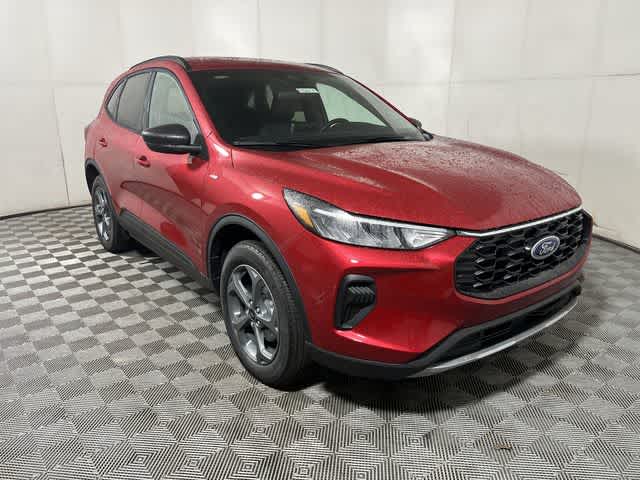 2026 Ford Escape ST-Line in Rapid Red Metallic Tinted Clearcoat — front three-quarter view