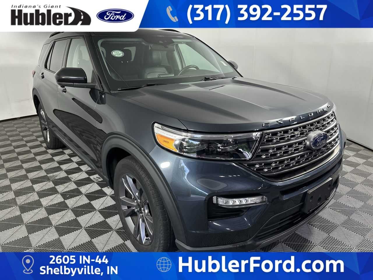 2022 Ford Explorer XLT in Stone Blue Metallic — front three-quarter view